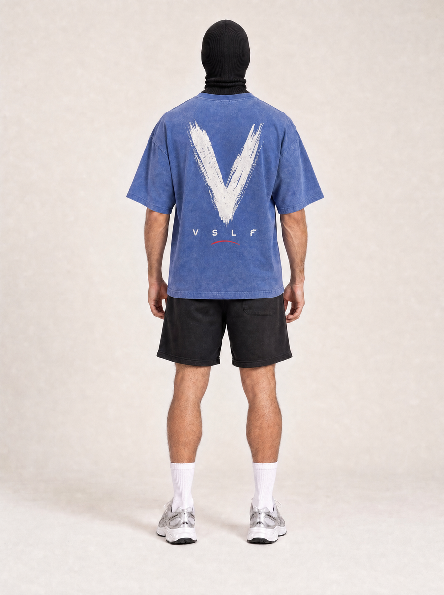 VSLF Built Different Tee - Washed Blue — rear view on the full-cover Faceless model.